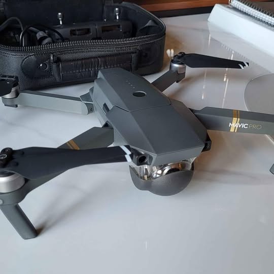 DJI Mavic Pro drone with folded propellers, gray body