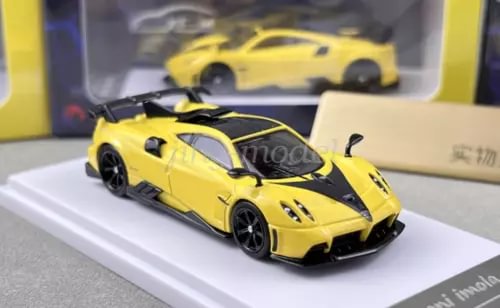 Yellow sports racing diecast car model with black wheels and front grille detail