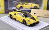 Yellow sports racing diecast car model with black wheels and front grille detail