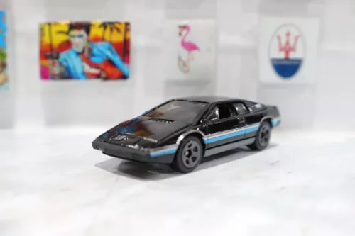 Black 1:64 diecast toy car with blue side stripe and black wheels