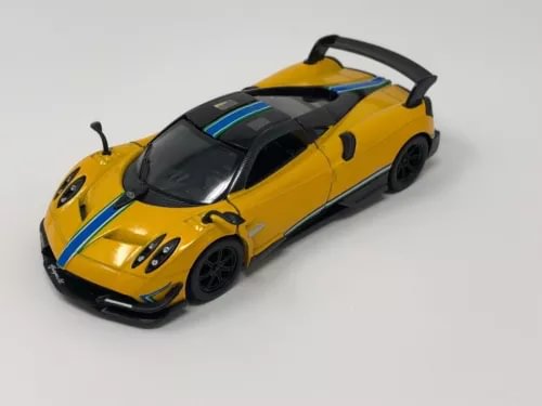Yellow Pagani Huayra BC livery diecast toy car with blue stripe and black details, 1:38