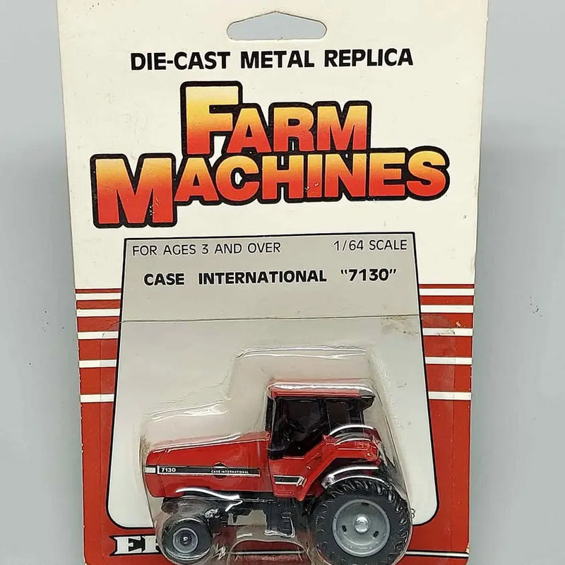 Die-cast toy tractor in blister pack, red Case International 1/64 scale replica