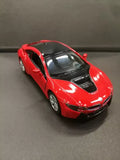 Red diecast toy sports car model with open doors and black hood detail