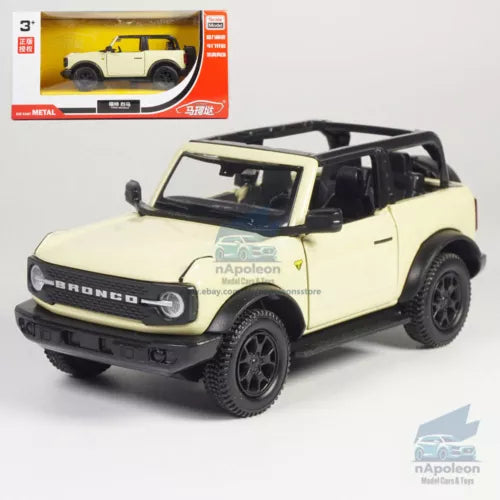 Beige alloy diecast off-road model car with black wheels and open-top body