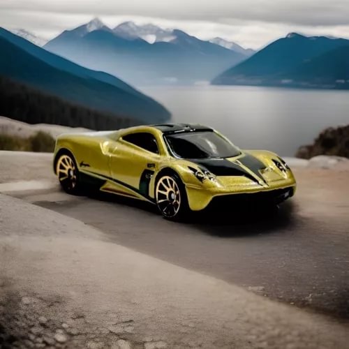 Metallic yellow diecast coupe with black hood accents and racing stripes