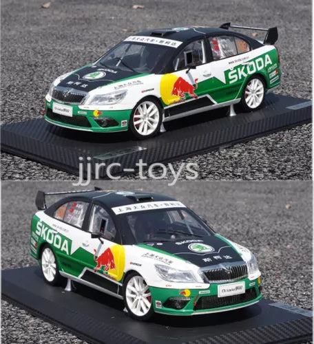 Skoda racing diecast car model with green, white and black livery on display base