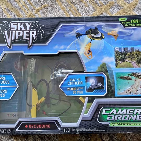 Quadcopter drone retail box with built-in camera and quadcopter graphic