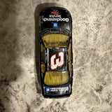 Diecast race car in black with yellow interior and red white number 3 on hood