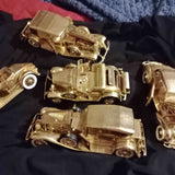 Metallic gold die-cast vintage car set of three cars with detailed wheels