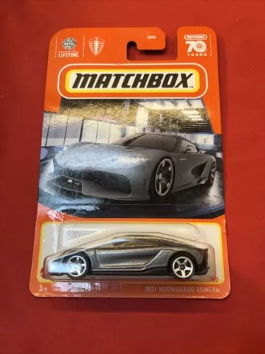 Matchbox diecast model car of a dark grey Koenigsegg Gemera in blister pack