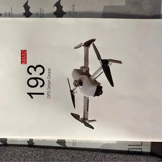 White quadcopter drone with four rotors and compact body