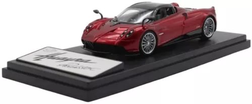 1:43 scale red Pagani Huayra Roadster diecast model on black display base