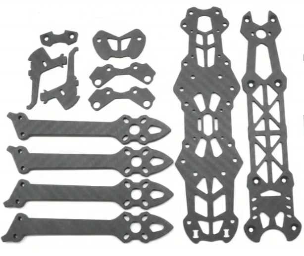 Black CNC carbon fiber mounting plates with cutout holes and slots