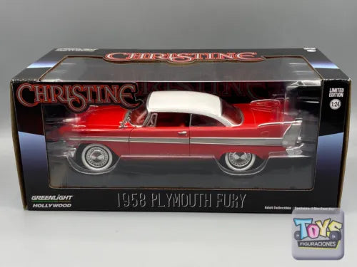 Red 1:24 diecast model car in clear retail box with black packaging