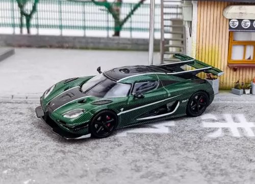 Green and black racing diecast model car toy, front three-quarter view
