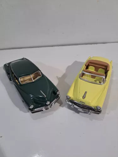 Diecast toy car set with dark green and yellow vintage cars, top view