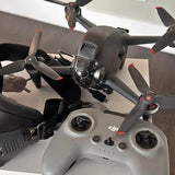 DJI FPV drone with gray body, front camera, and 4 propellers