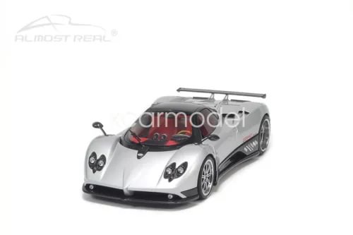 Metal diecast sports car model in silver with black accents, front 3/4 view