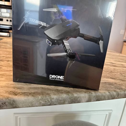Drone with camera in retail box with front drone image