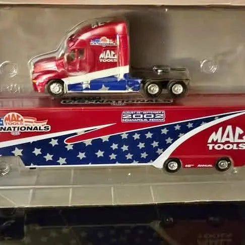 Diecast truck set with red-and-blue truck and small black vehicle