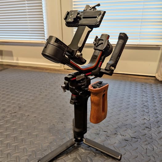 Camera gimbal stabilizer with wooden grip and mounted control module