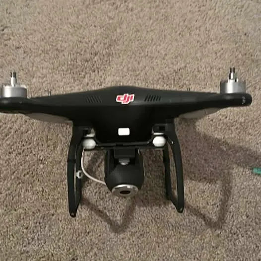 DJI drone with front camera housing and landing legs
