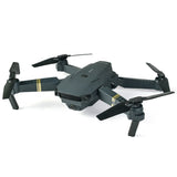 Black pocket quadcopter drone with 4K-style camera and four foldable propellers