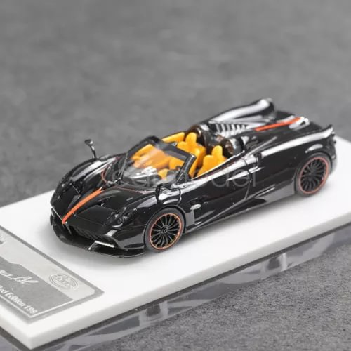 Black diecast convertible sports car model with orange interior and detailed wheels