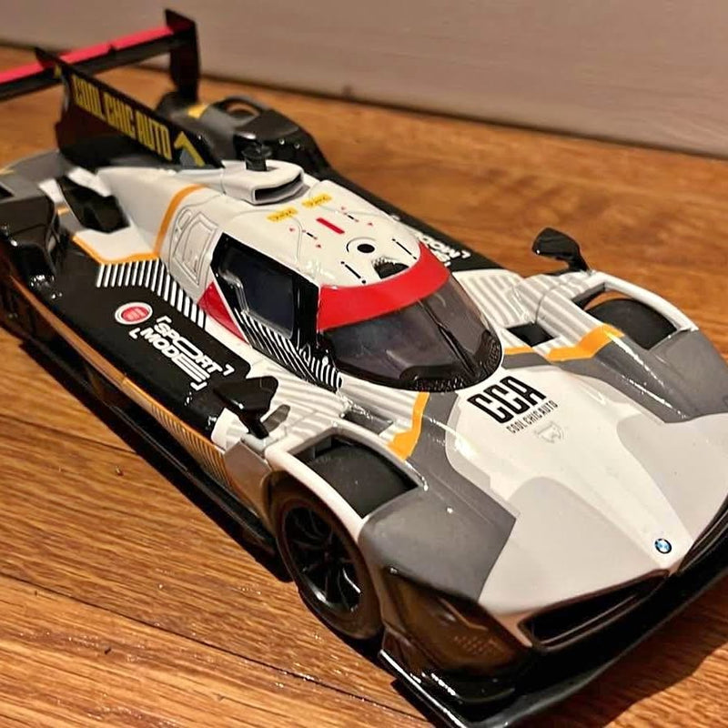 1:24 diecast exotic race car model in white with red stripe and black aero details