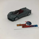 Pagani Huayra Roadster diecast model car, dark green convertible with detailed wheels