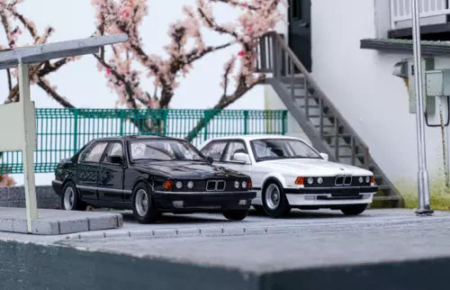 Alloy diecast BMW E32 735i car models, black and white, front view