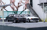 Alloy diecast BMW E32 735i car models, black and white, front view