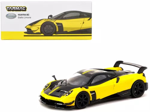 Yellow and black 1/64 diecast sports car model, front 3/4 view with black wheels