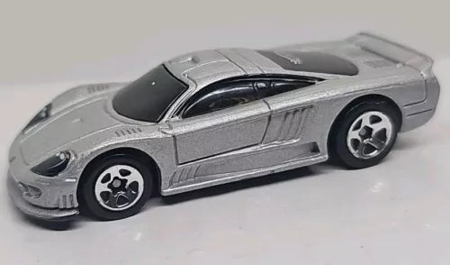 Silver 1:64 diecast sports car with black windows and hood detail