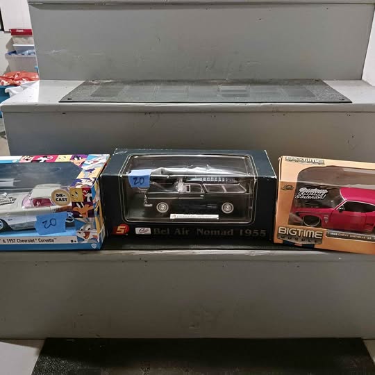 Black diecast car model in display box, 1955 Bel-Air Nomad wagon