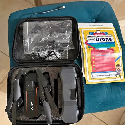 JTBBKing 1080p UAV drone kit in open carrying case with accessories and manual