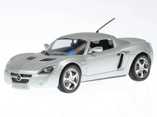 Silver diecast sports car model with black roof, front three-quarter view.