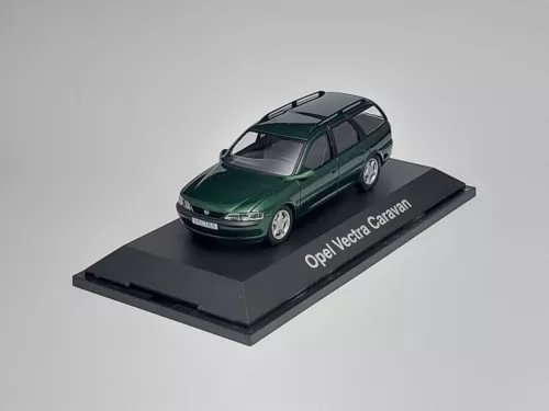 1:43 diecast model car of dark green Opel Vectra Caravan on black display base