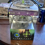 Toy drone in retail packaging, showing two circular rotor assemblies
