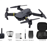 Foldable quadcopter drone with camera, four propellers, and black carrying case