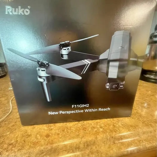 Ruko drone with four propellers and a compact controller-mounted camera