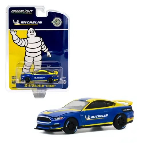 Diecast model car in blue and yellow with Michelin-style racing decals, 1:64 scale