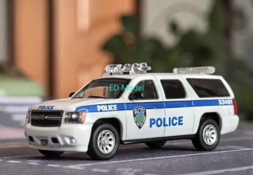 Diecast metal police SUV model toy with white, blue livery and roof lights