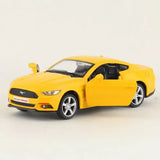 Yellow 2015 Ford Mustang diecast model car, door open, front three-quarter