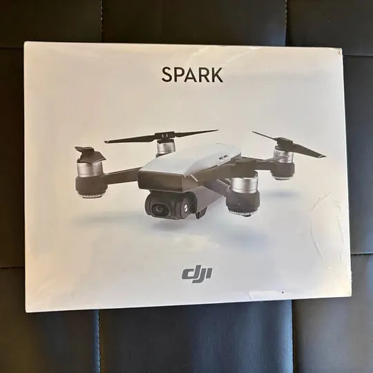 DJI Spark drone box with printed quadcopter and four propellers