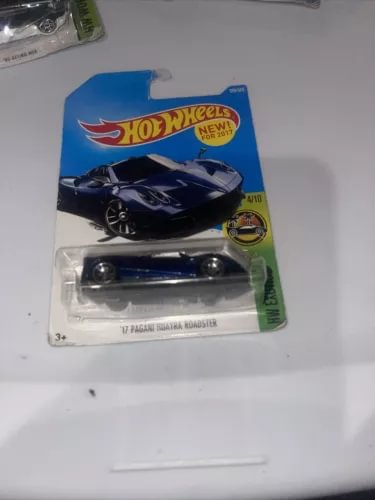 Hot Wheels die-cast toy car in blister pack, dark blue roadster, 1:64 scale