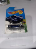 Hot Wheels die-cast toy car in blister pack, dark blue roadster, 1:64 scale