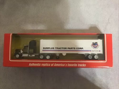 Diecast sleeper cab tractor model in red display box, Surplus Tractor Parts Corp.