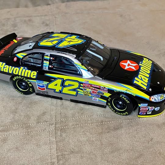 Diecast race car with #42 Havoline graphics, black yellow and blue, front 3/4 view