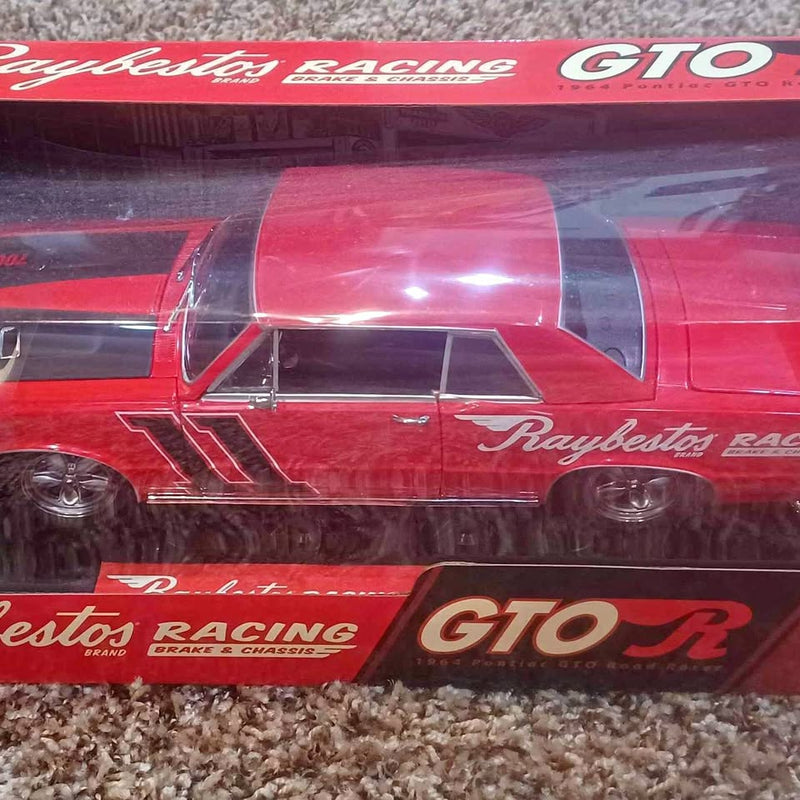 Red 1964 Pontiac GTO R diecast model with Raybestos Racing decals, side view